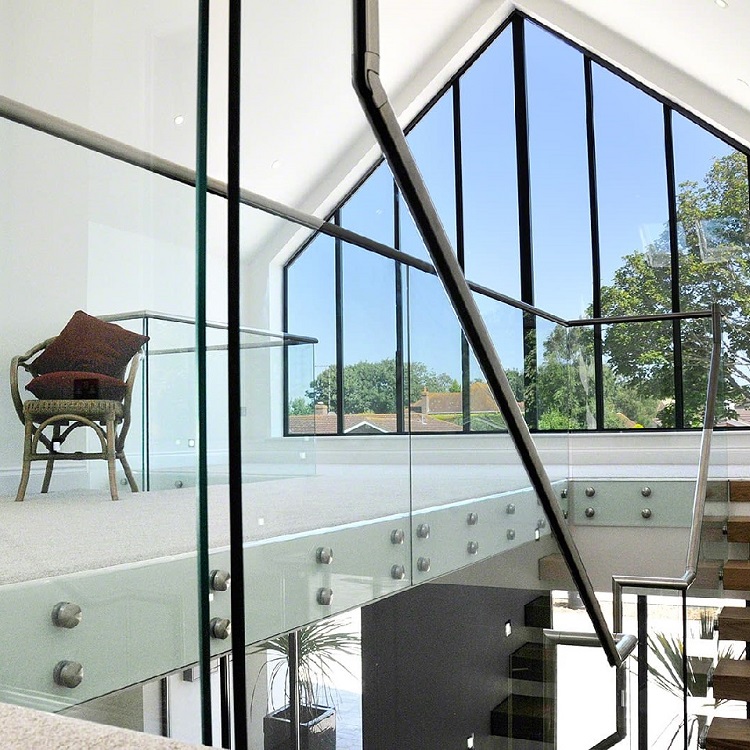 Indoor stairwell side mounted standoff glass railing with top handrail