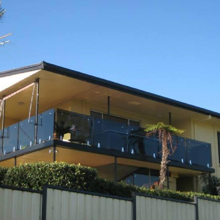 Dark grey glass railing with spigots fixings 